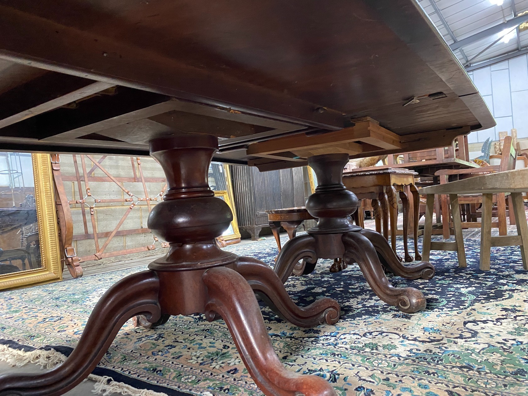 A Victorian mahogany twin pillar dining table, in need of restoration, length 203cm, width 138cm, height 75cm